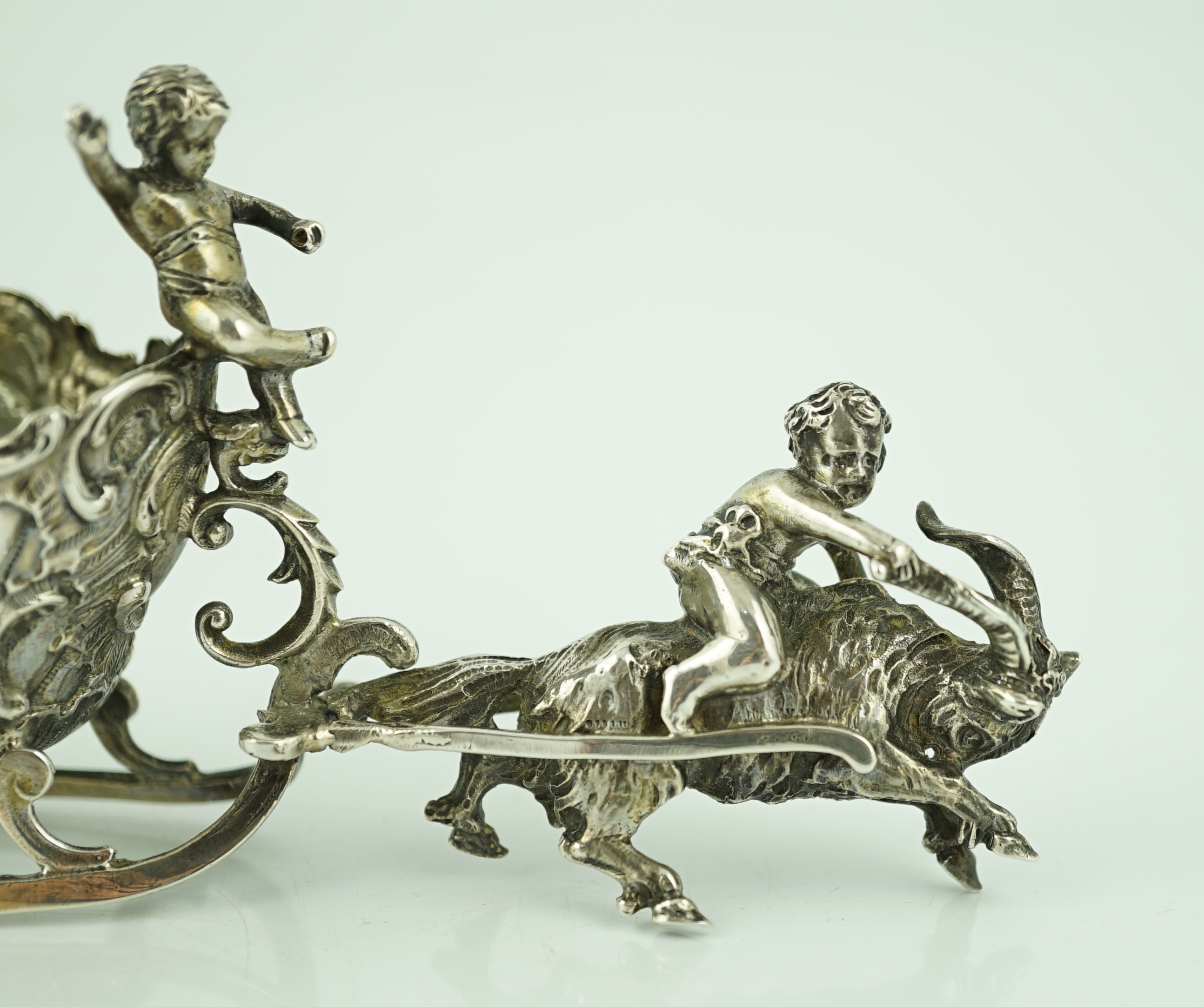 A late 19th century miniature silver model of a sleigh with putti, pulled by a goat, import marks for John George Smith